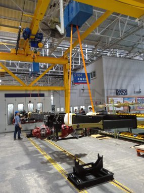 Axle overturning crane in auto workshop