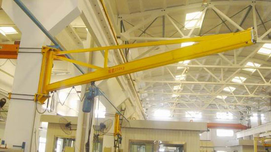 Wall-mounted jib crane systems
