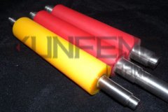 What factors affect the adhesion of rubber in polyurethane rollers?